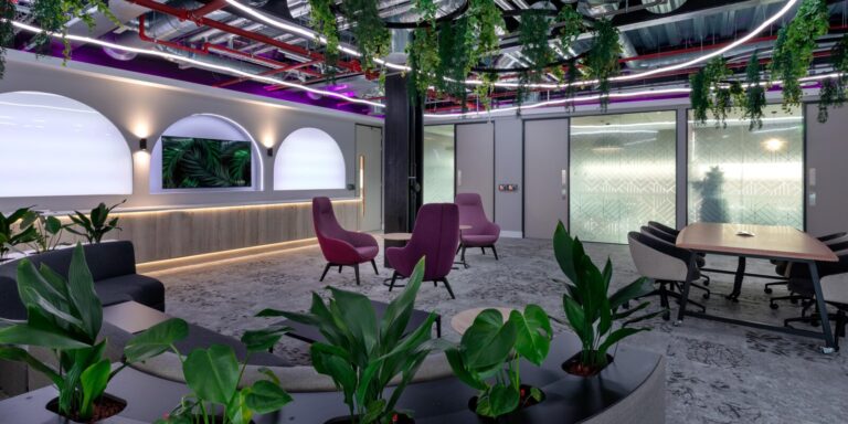 Medium shot of contemporary office with purple chairs