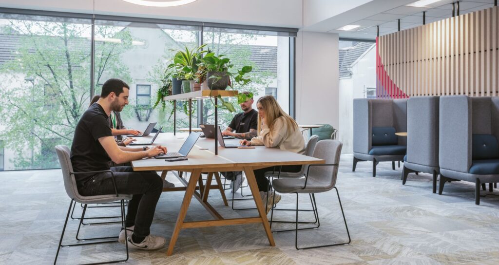 A team collaborating in an open plan office